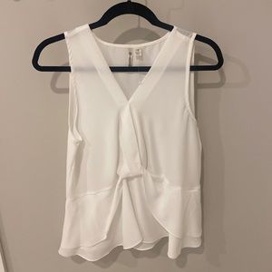 Silky, white tank top. Never worn.